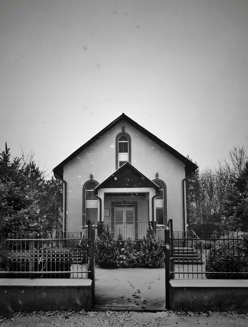 a black and white photo of a church