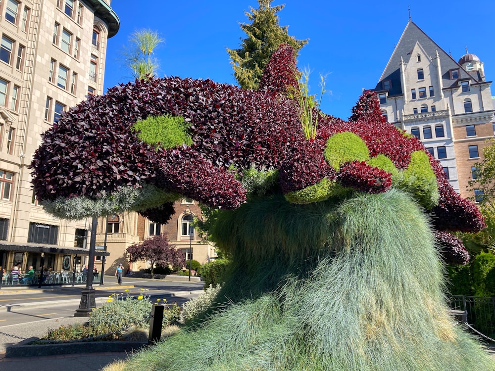 a sculpture of a plant with a face made out of it