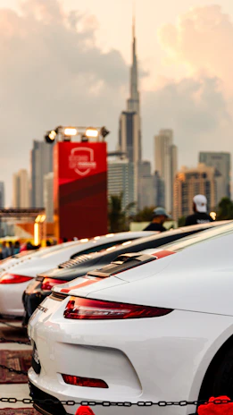 A fleet of key4car service vans lined up in front of a city skyline ready to respond nationwide.
