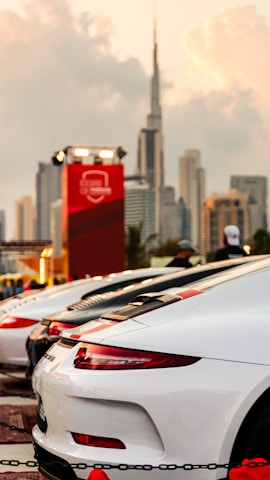 A sleek lineup of diverse rental cars ready for corporate journeys under the open Indian sky.