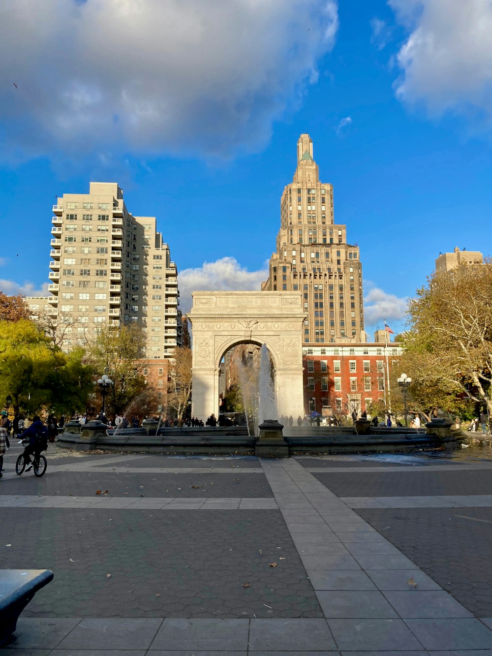 a view of a city with a fountain in the middle