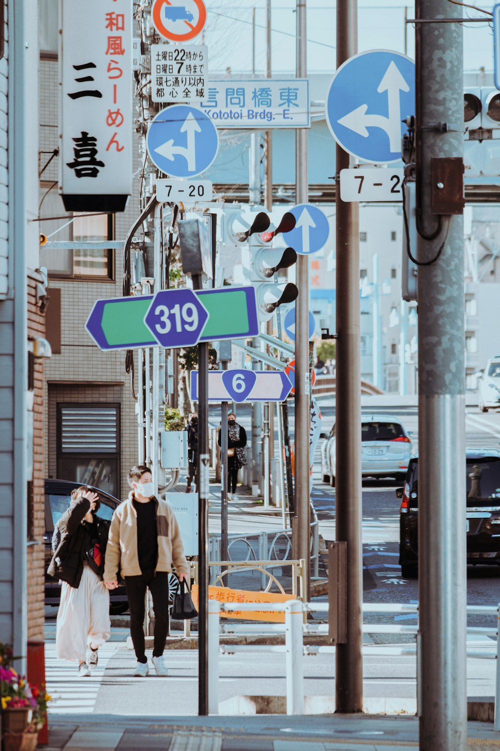 a couple of people walking down a street