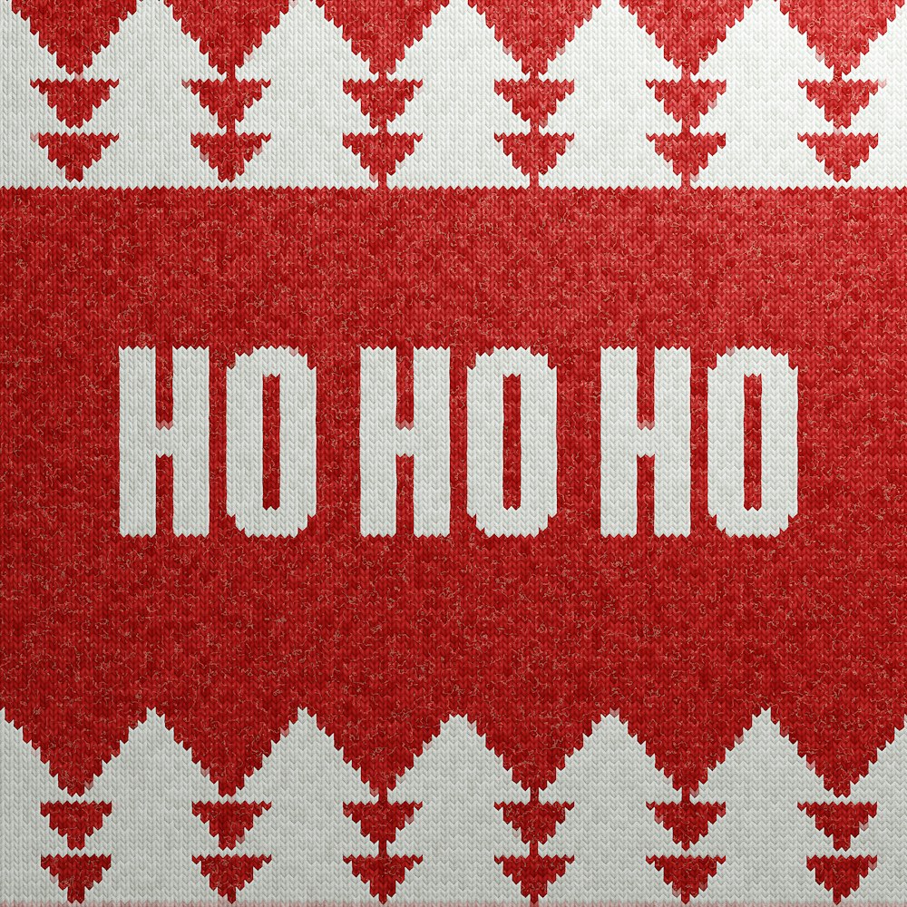 a knitted christmas sweater with the word ho ho on it
