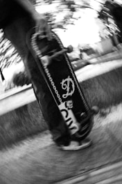 a man riding a skateboard down a street