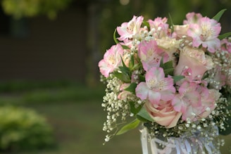 A charming floral arrangement with pastel roses and baby's breath, ideal for special occasions.