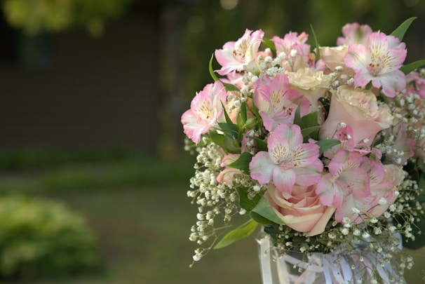 A charming floral arrangement with pastel roses and baby's breath, ideal for special occasions.