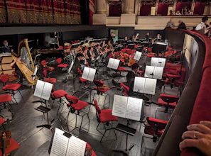 Musicians tuning their instruments before a live performance
