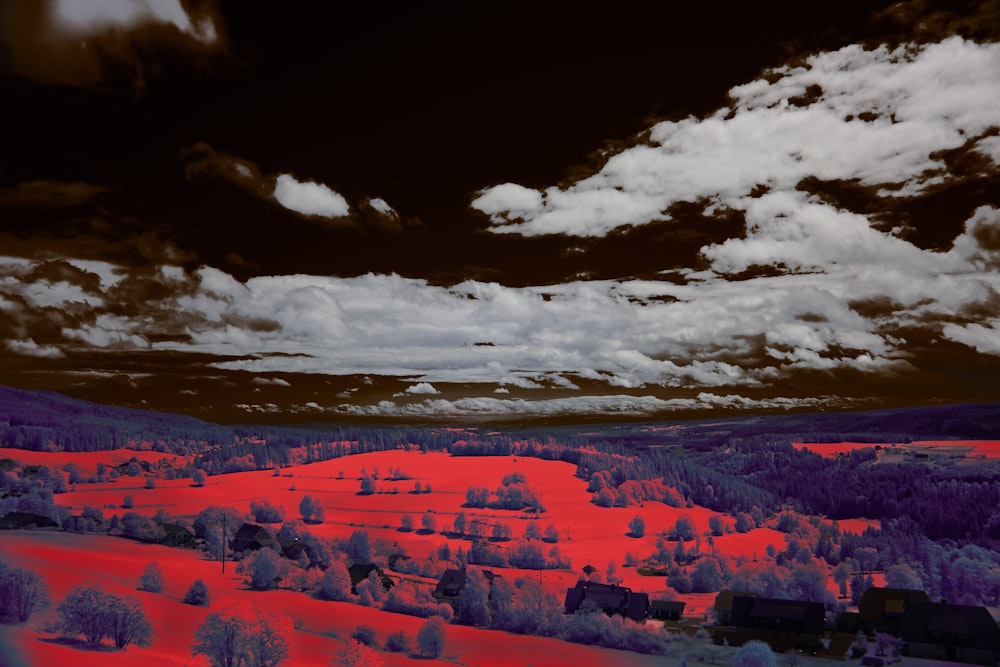 a infrared image of a landscape with trees and clouds