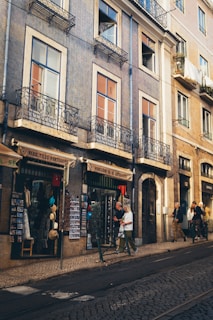 Scenic European street stroll with women admiring historic architecture and vibrant local markets.