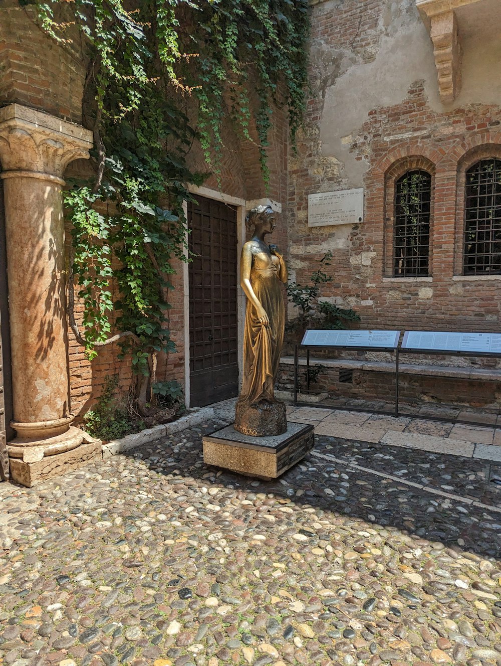 a statue of a woman in a courtyard
