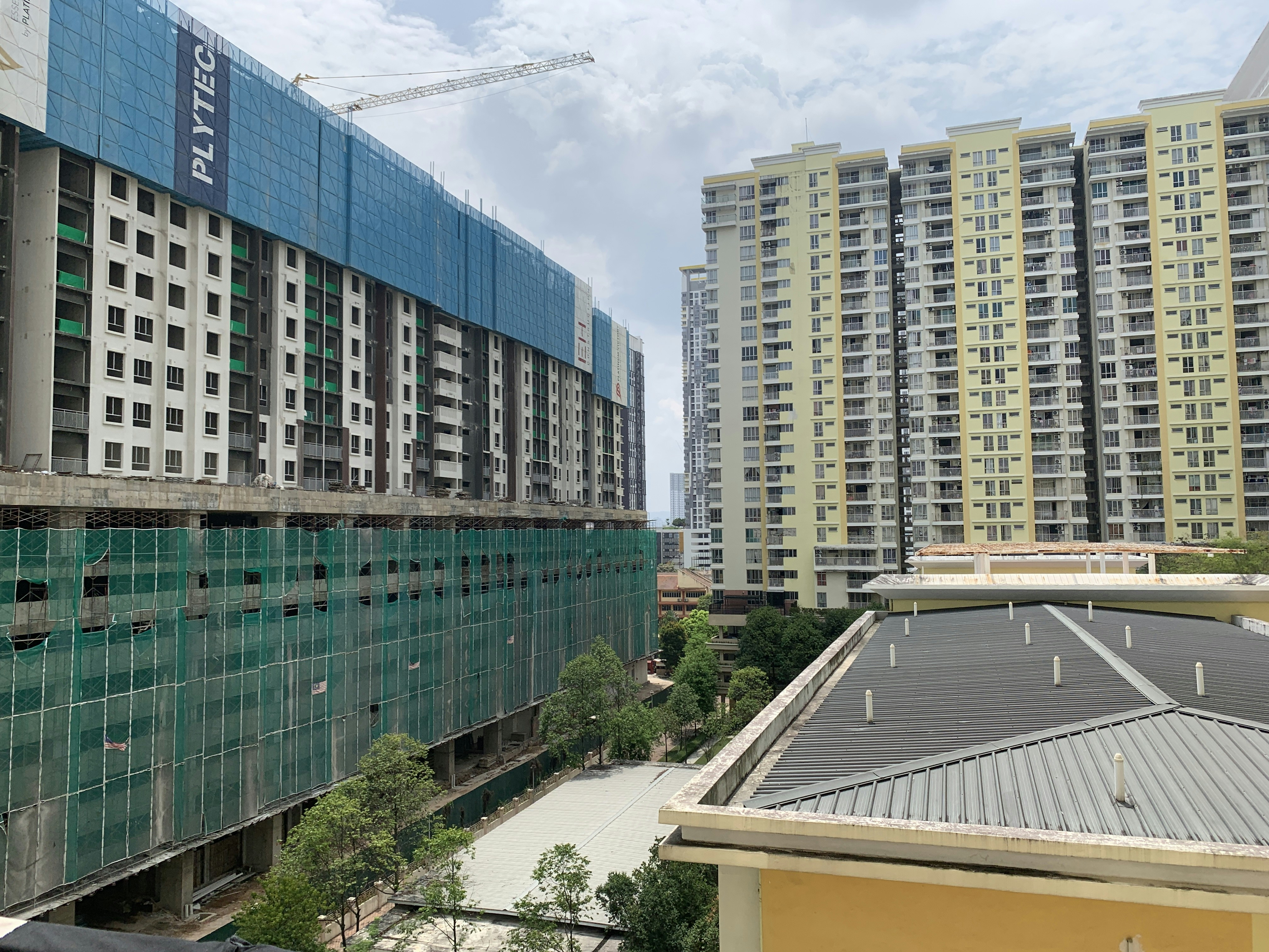 a building under construction with a crane in the background