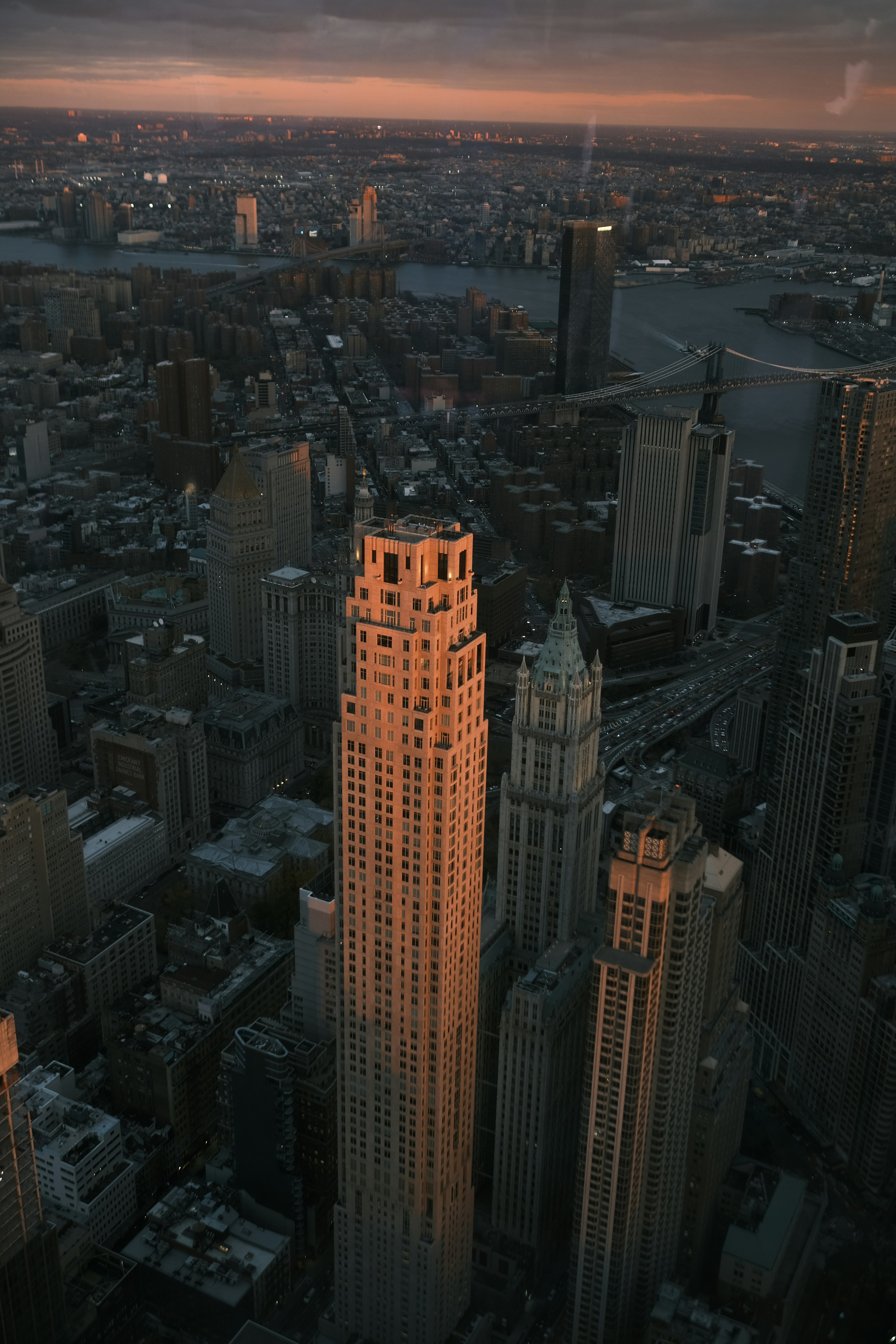 a very tall building towering over a city