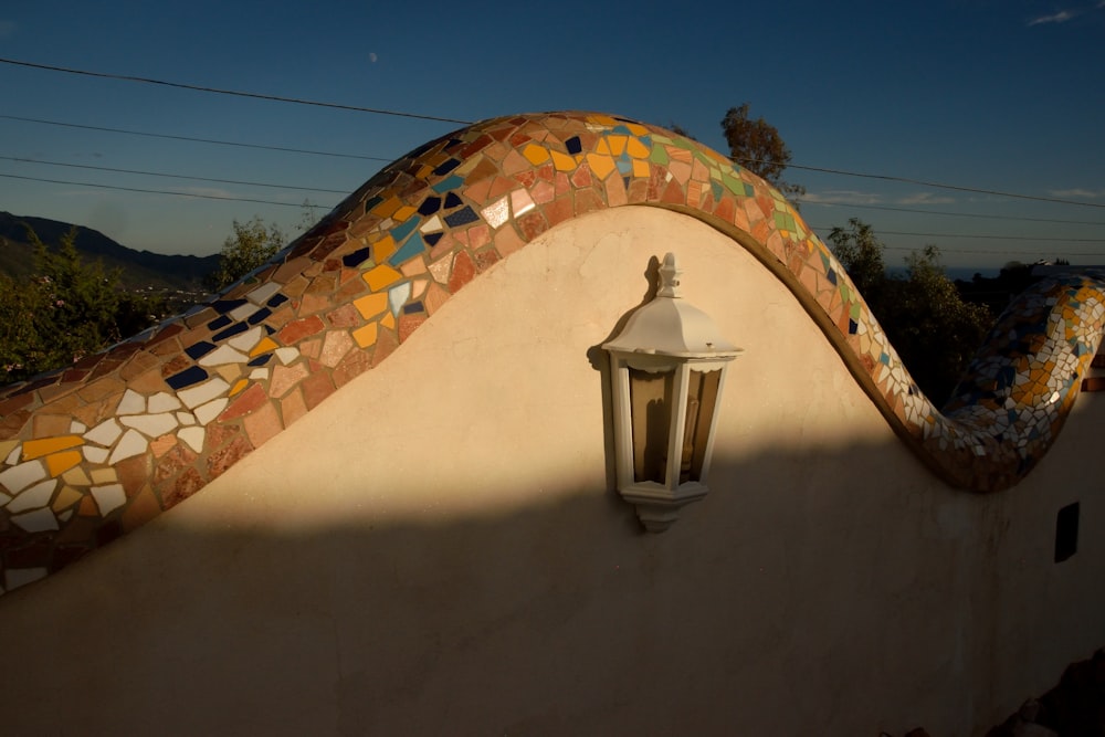 a lamp on the side of a building