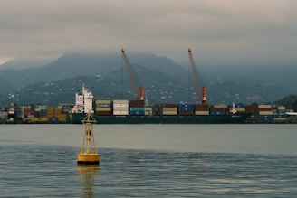 a yellow buoy floating on top of a body of water