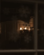 Elegant wall sconces glowing softly in a hallway setting.