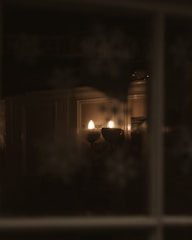 Subtle wall sconces highlighting artwork in a stylish office space.