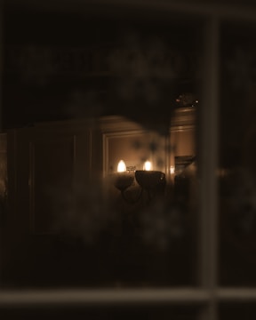 Subtle wall sconces highlighting artwork in a stylish office space.