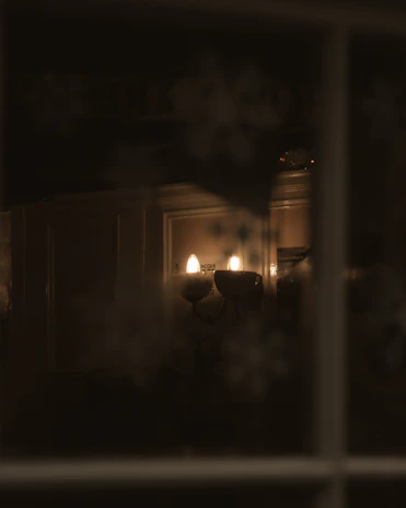 A dimmable wall sconce adding subtle ambiance to a modern living room.