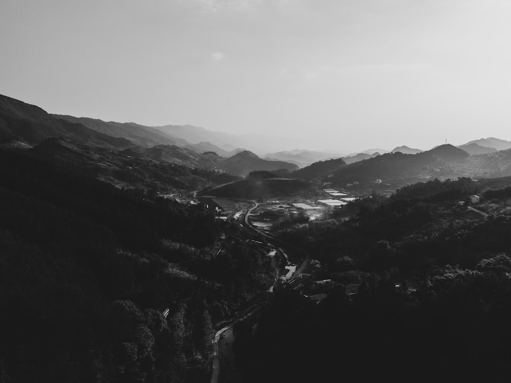 a black and white photo of a valley
