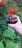 Close-up of manicured hands holding a glass
