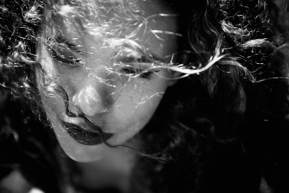 a black and white photo of a woman's face