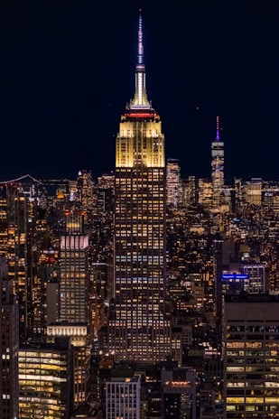 Nighttime cityscape featuring illuminated bank buildings symbolizing trust