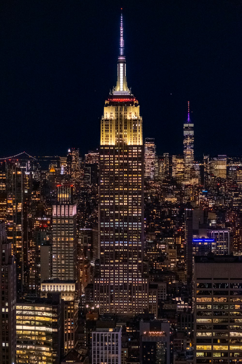 a view of a city at night from the top of a building