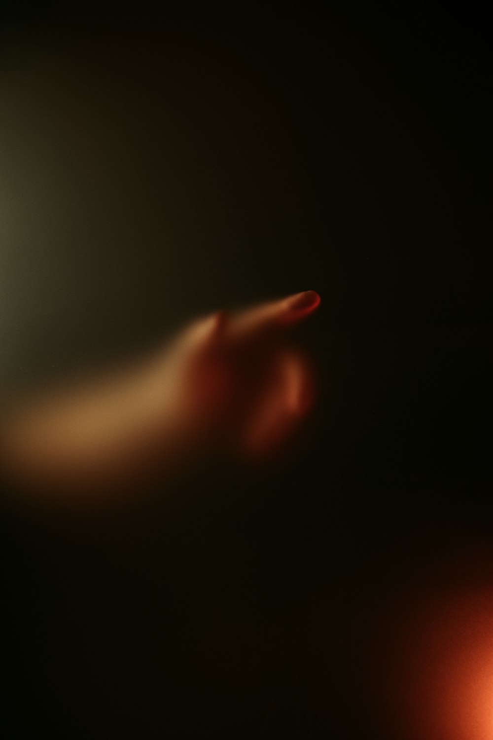 a blurry image of a red object in the dark