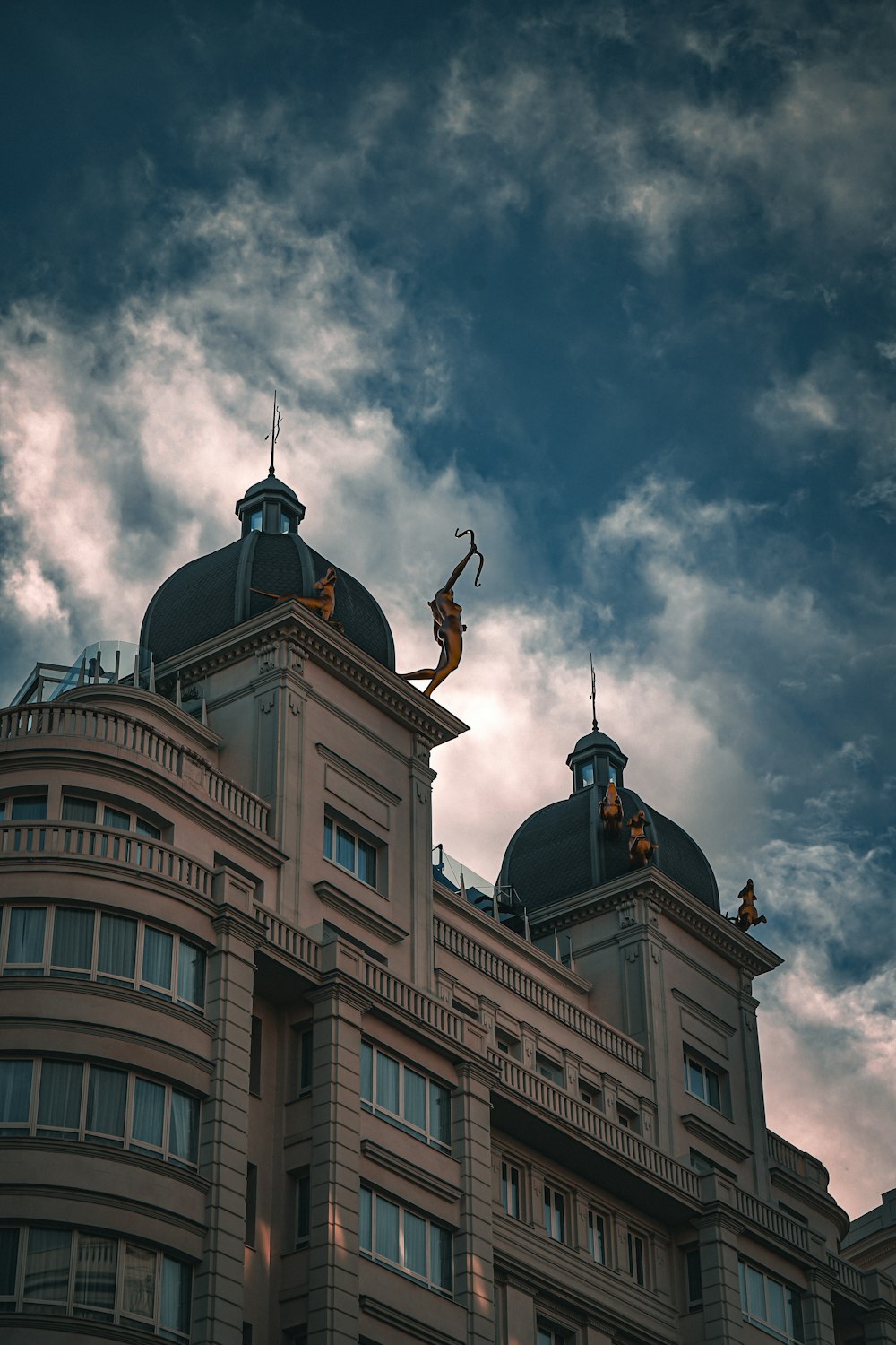 a tall building with a sky background