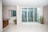 A bright living room featuring elegant bifolding doors opening to a garden.