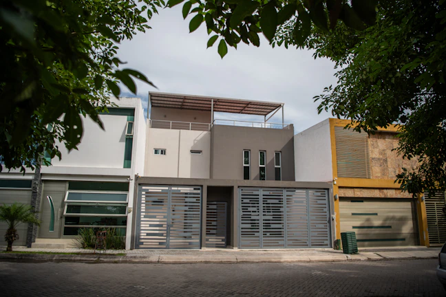 Exterior house facade showing crisp new paint job in clean white and gray.
