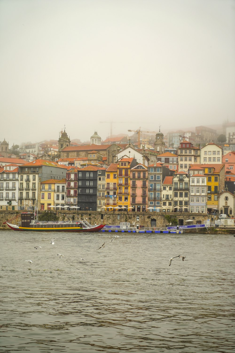 a large body of water with a city in the background