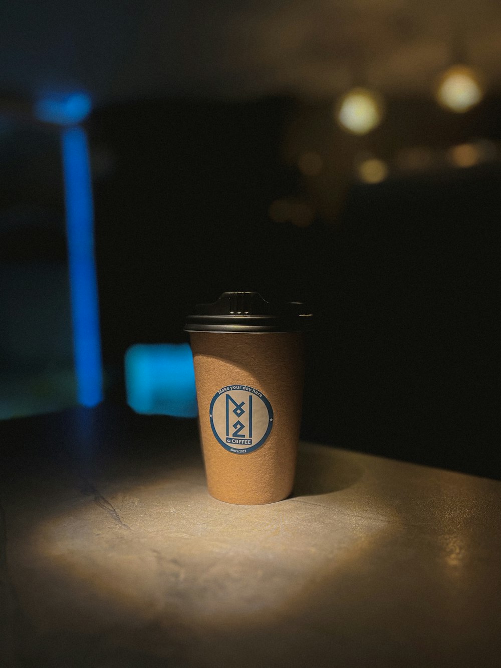 a coffee cup sitting on top of a table