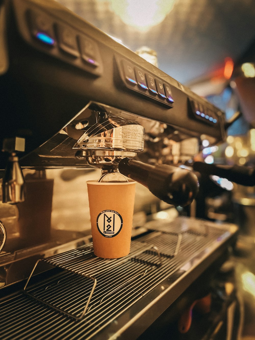 a coffee cup sitting on top of a coffee machine