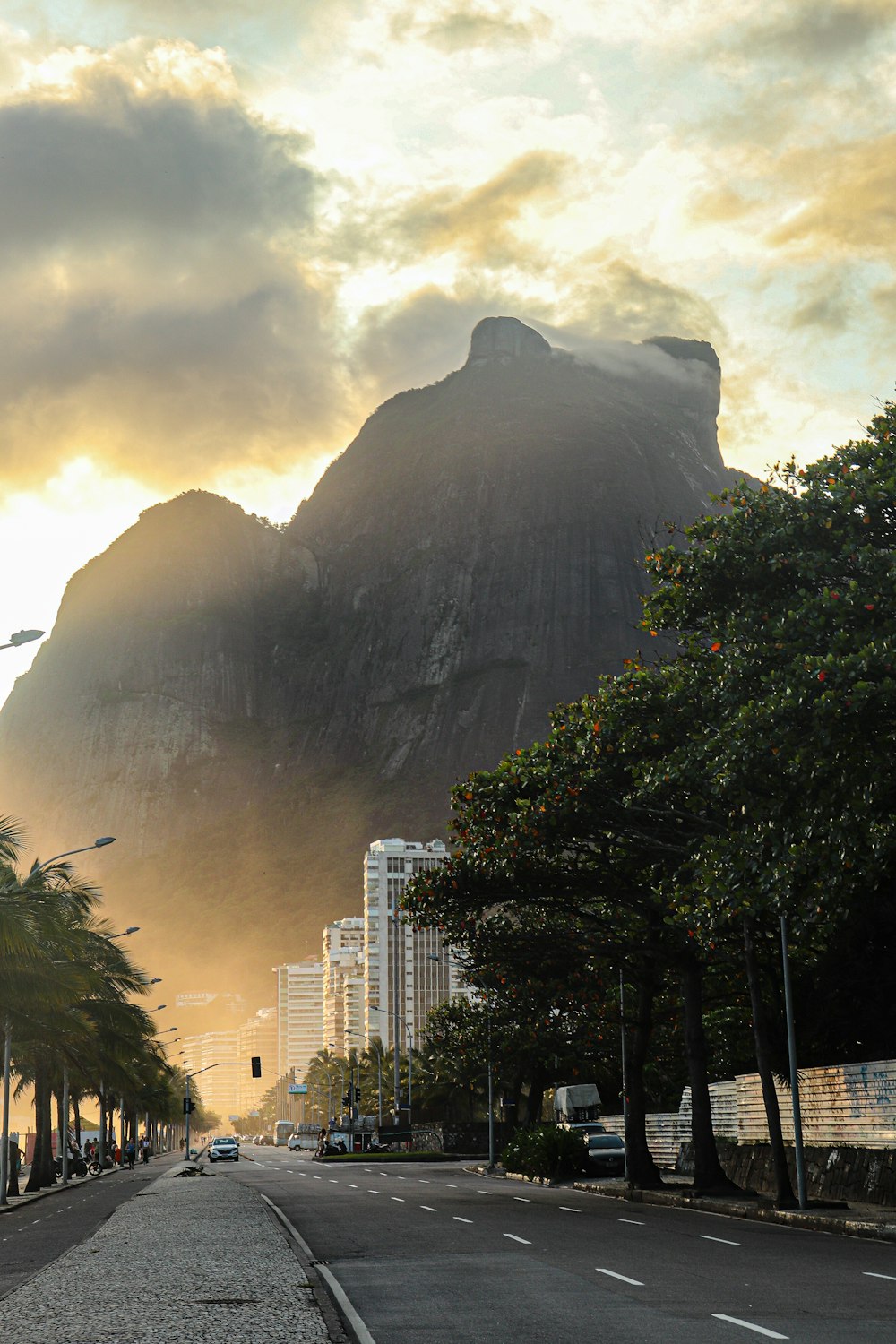 a street with a mountain in the background