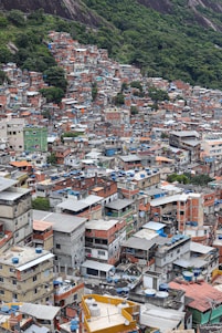 a large group of buildings with a mountain in the background