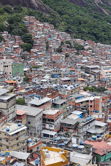 a large group of buildings with a mountain in the background