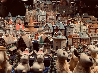 A detailed Lemax village display with festive decorations.
