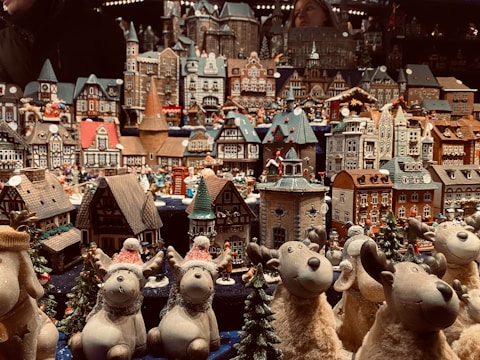 A detailed Lemax village display with festive decorations.