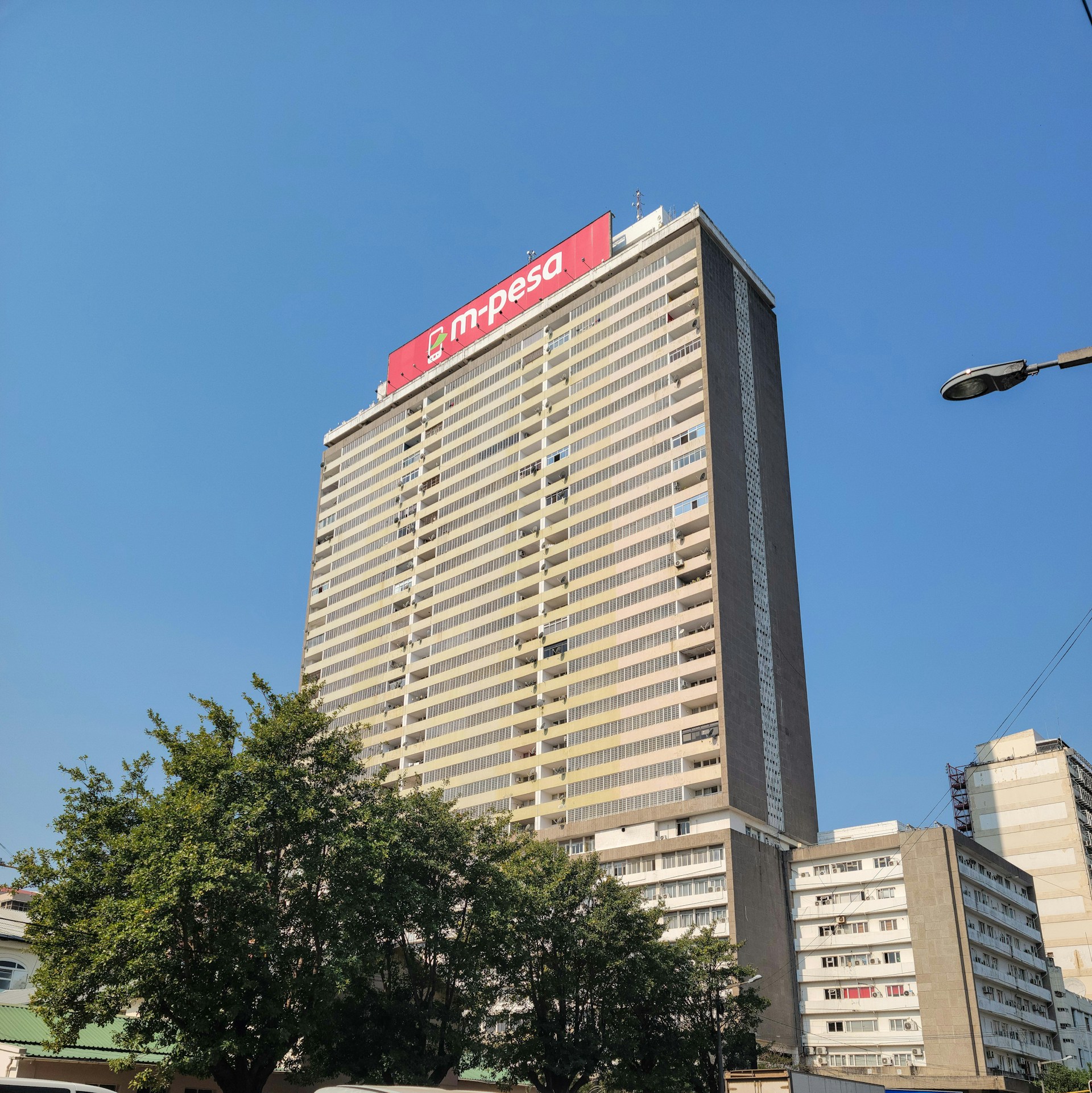 woman wearing yellow long-sleeved dress under white clouds and blue sky during daytime