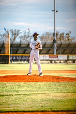 a baseball player standing on top of a field