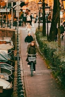 a person riding a bike down a street