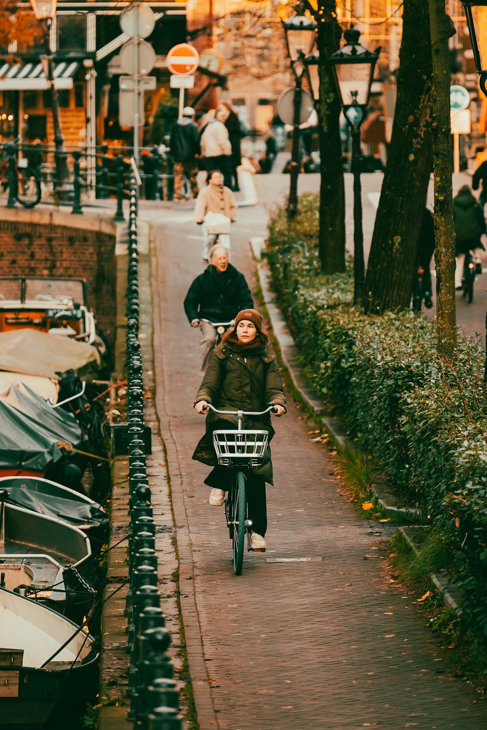 a person riding a bike down a street