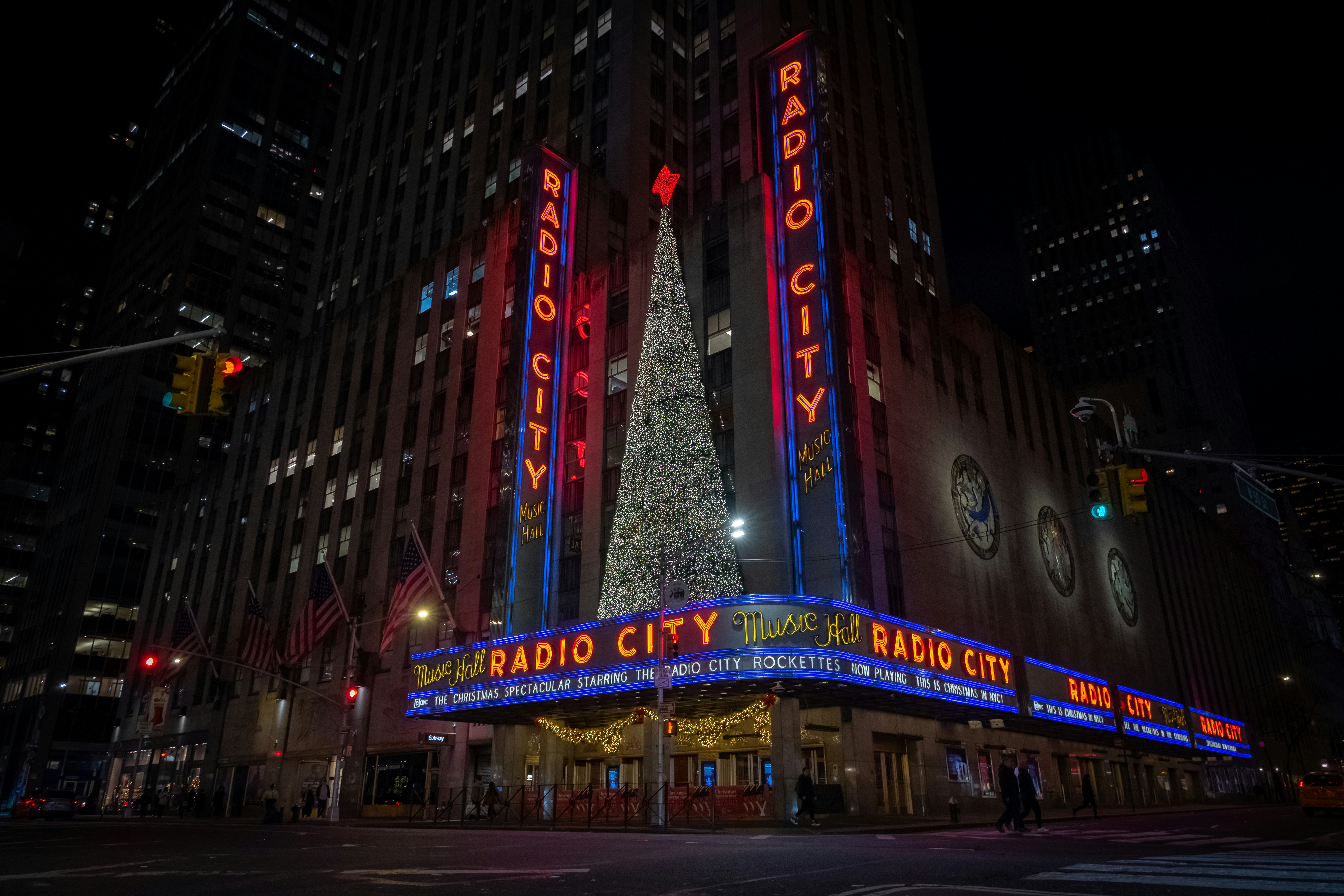 the radio city christmas tree is lit up in red, white and blue
