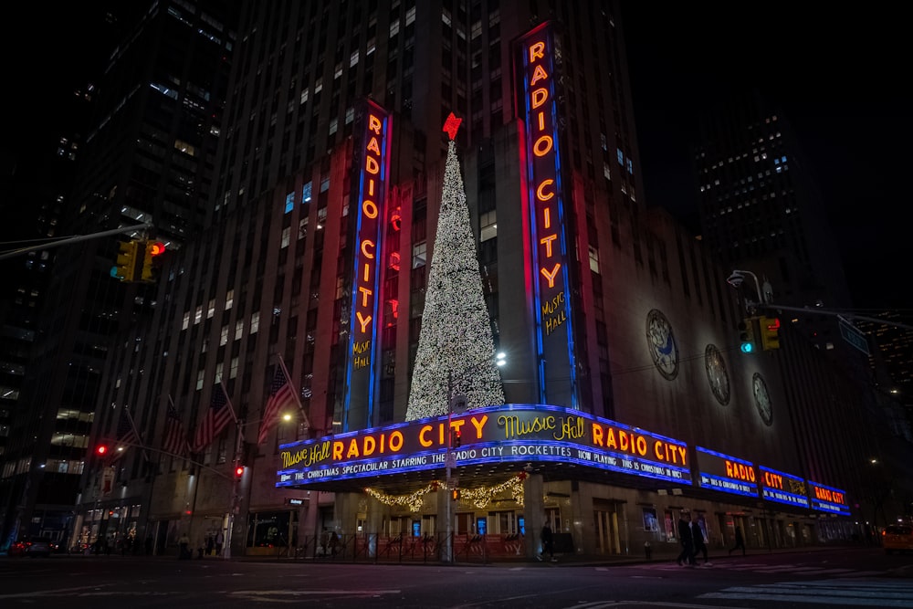the radio city christmas tree is lit up in red, white and blue