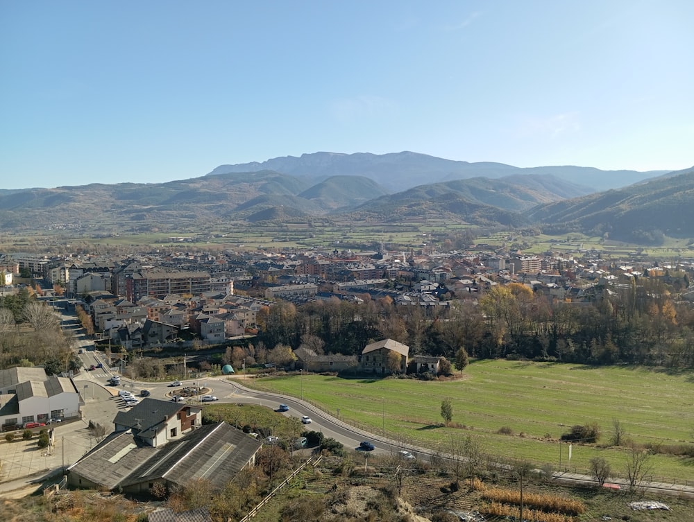 a view of a city with mountains in the background