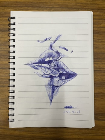 Close-up of a delicate pen drawing showing expressive faces from a poetic narrative.