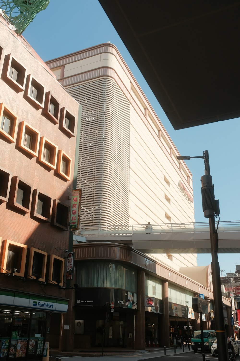 a tall building sitting next to a traffic light