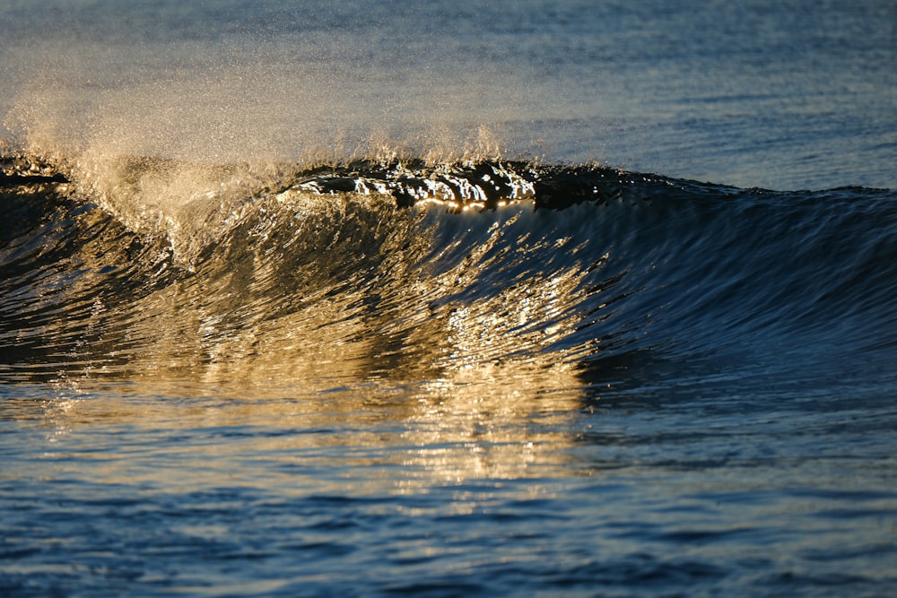 a person riding a wave on top of a surfboard