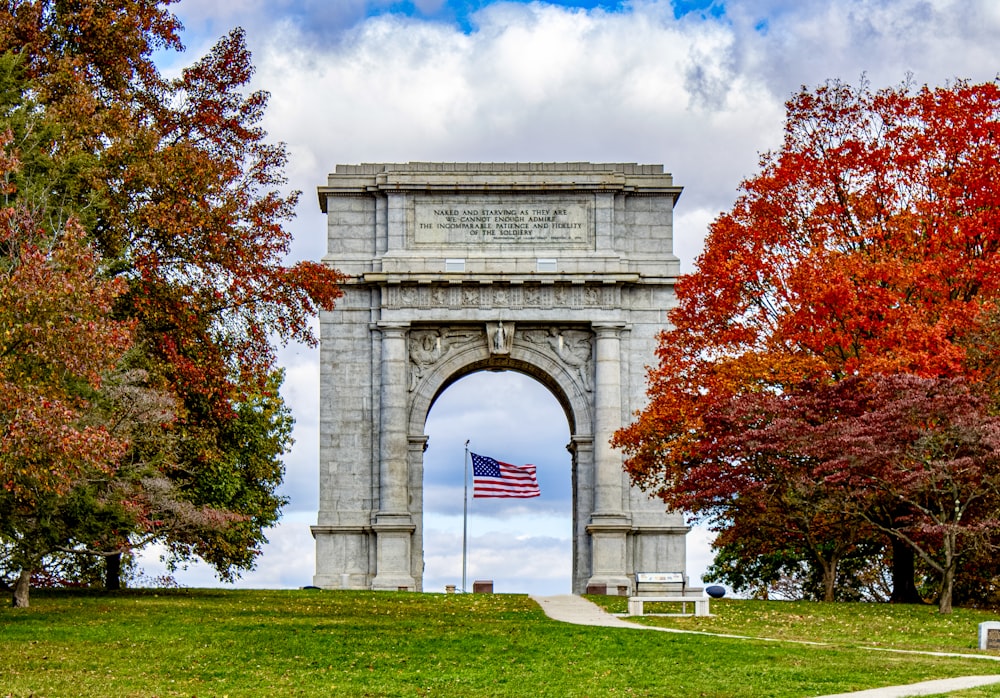 a monument with an american flag on top of it